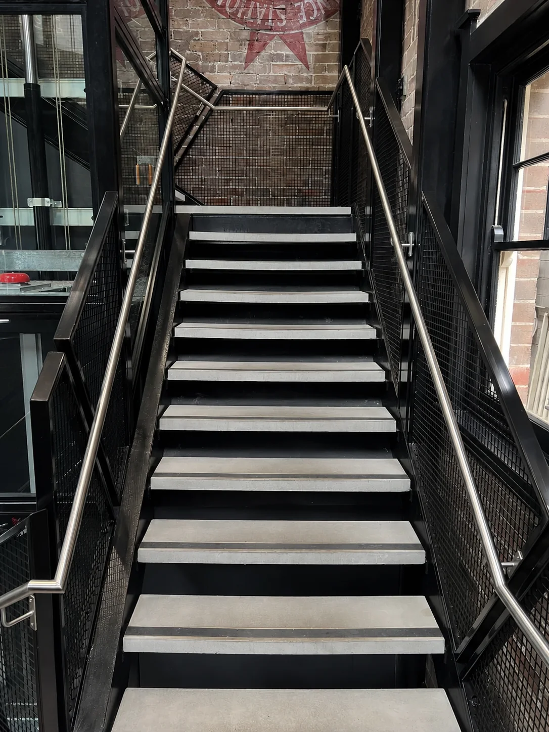 AA West flat step treads on a commercial staircase